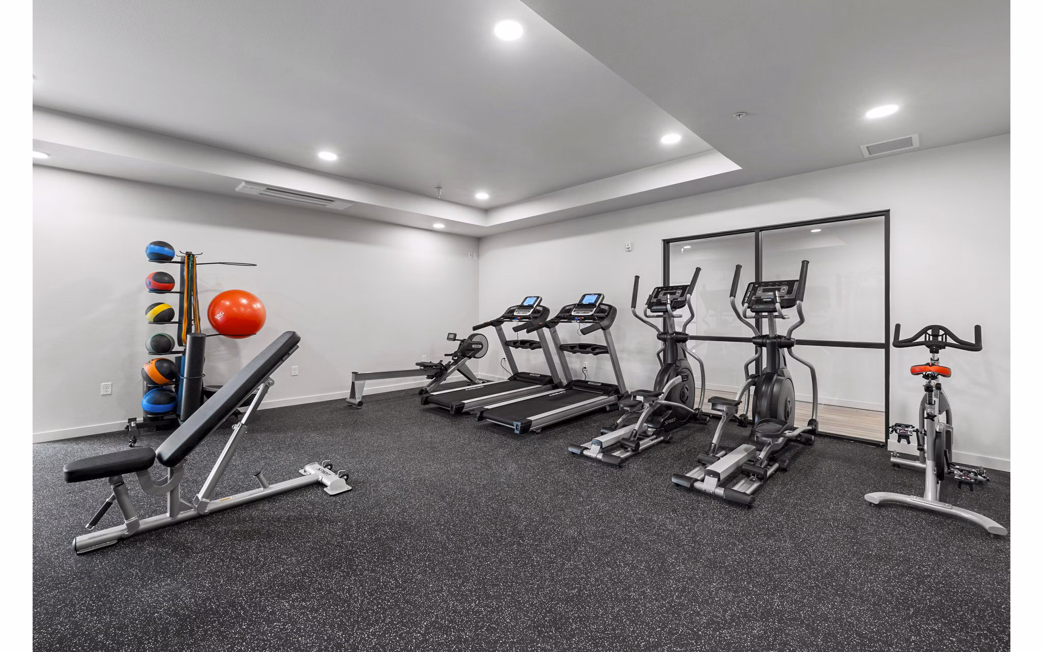 State-of-the-art fitness center featuring modern equipment at The Oliveen Apartments