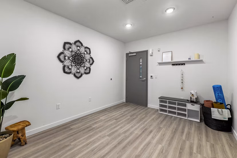 Yoga studio featuring natural light and modern equipment at The Oliveen Apartments