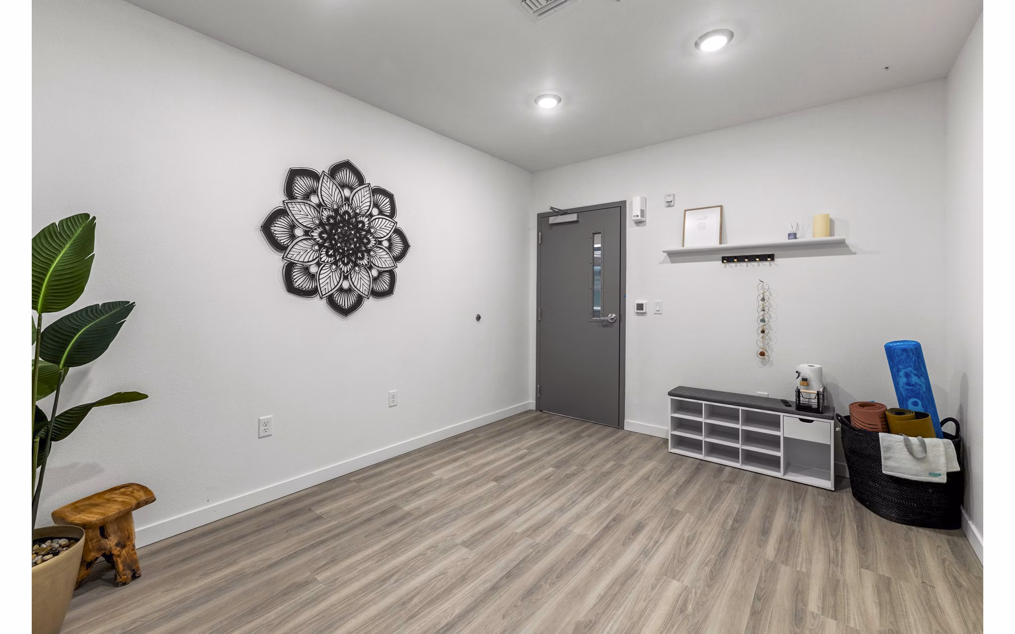 Yoga studio featuring natural light and modern equipment at The Oliveen Apartments