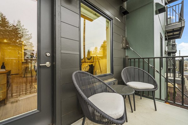 Cozy patio with garden views at The Oliveen Apartments