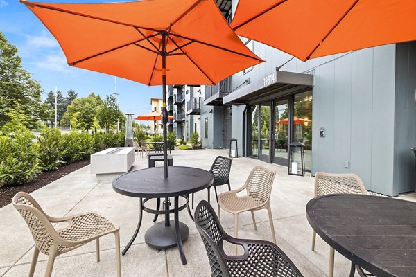 Cozy fire pit on patio at The Oliveen Apartments