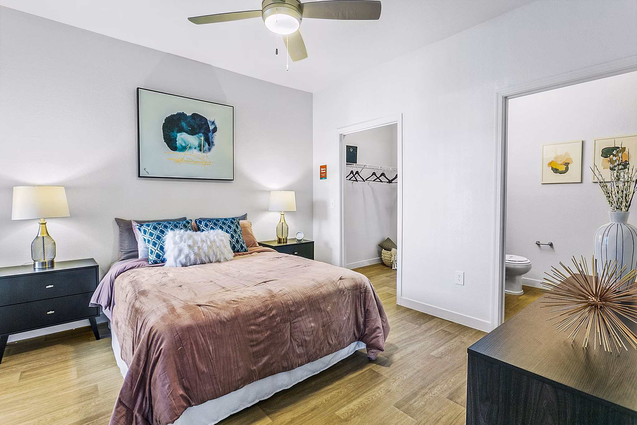 Cozy bedroom with modern design at Morada Rise Apartments, offering luxury living in a peaceful environment