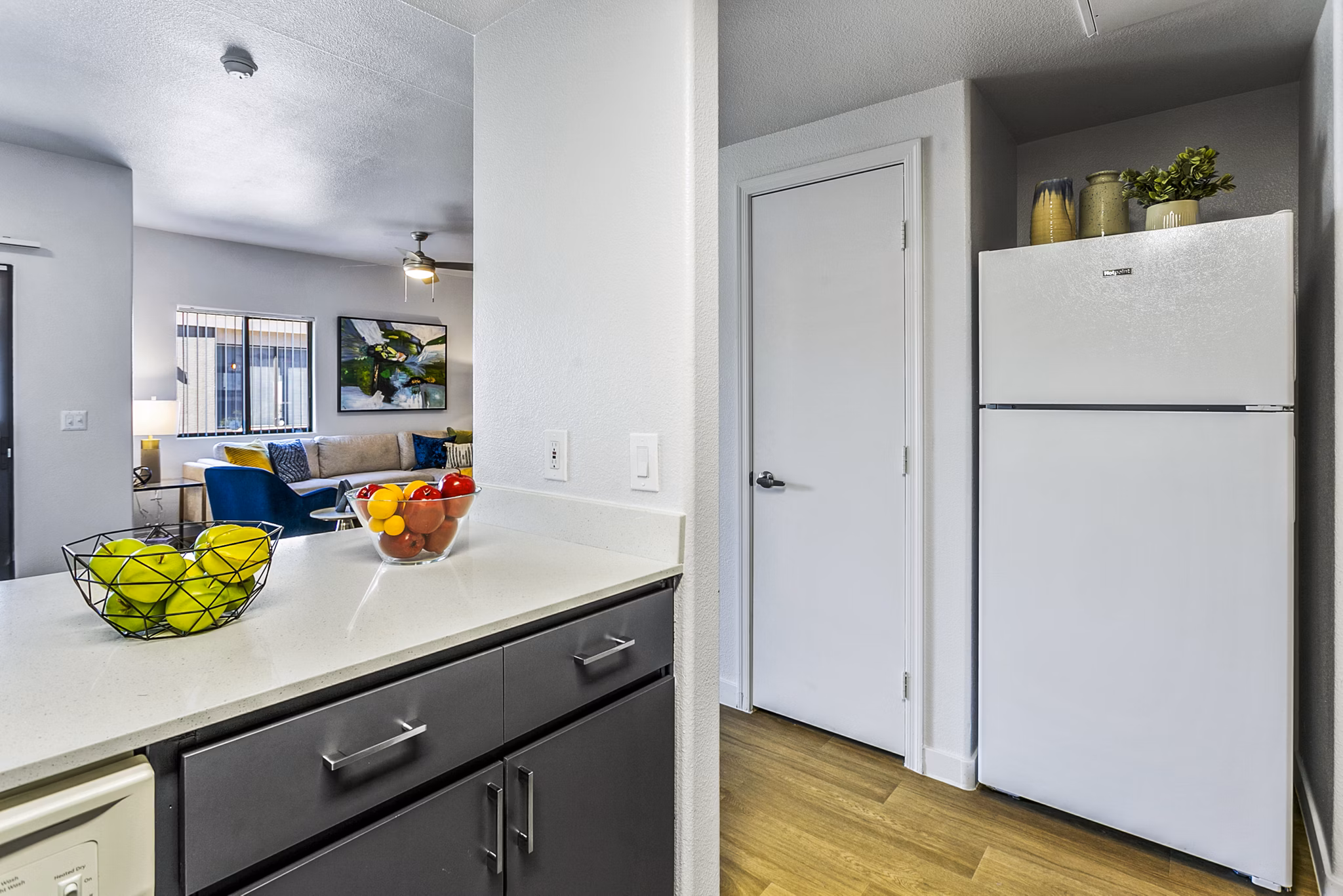 Modern kitchen with sleek countertops and stainless steel appliances at Morada Rise Apartments