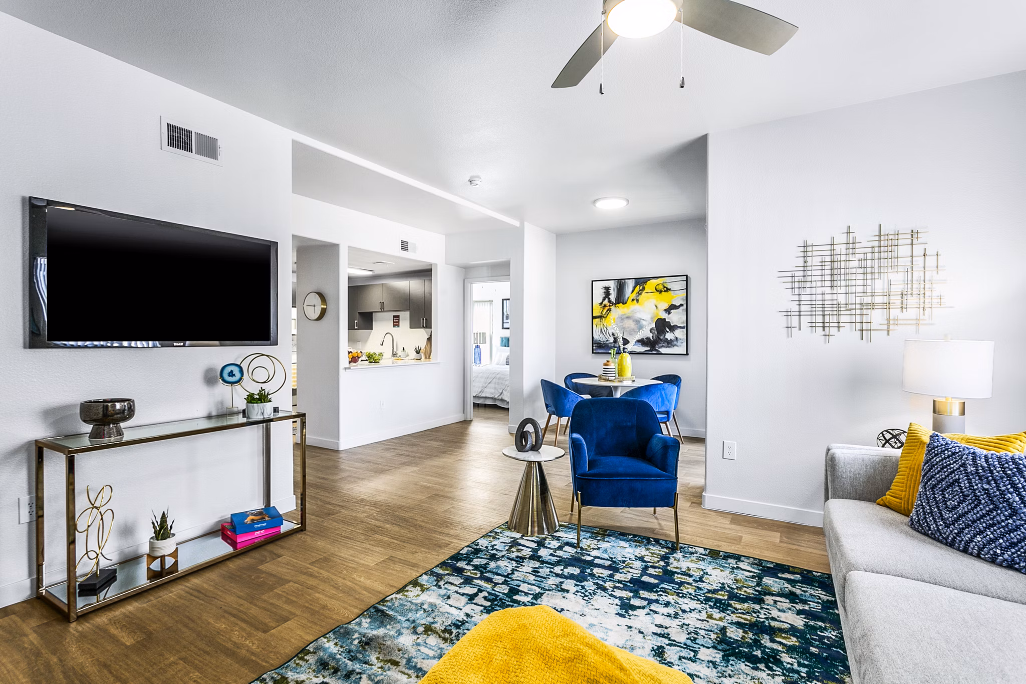 Spacious living room with modern furnishings and natural light in Morada Rise Apartments
