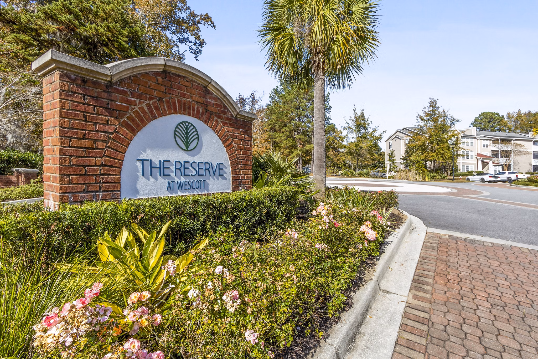 The Reserve at Wescott Apartments: Signage showcasing luxury living options in a serene setting