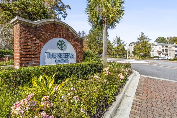 The Reserve at Wescott Apartments: Signage showcasing luxury living options in a serene setting