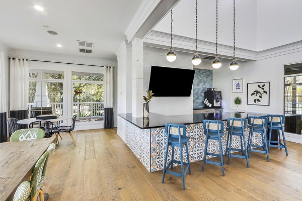 Clubhouse with modern decor and lounging areas at The Reserve at Wescott Apartments, a luxury Greystar property