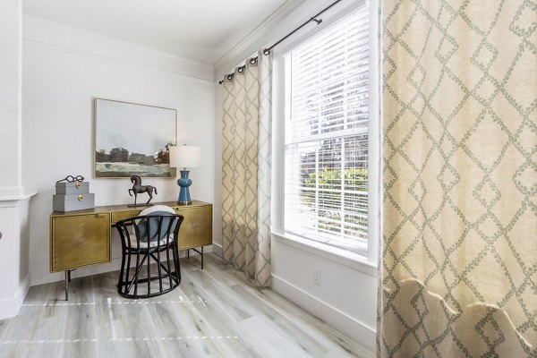 Home office with ergonomic chair and desk in The Reserve at Wescott Apartments