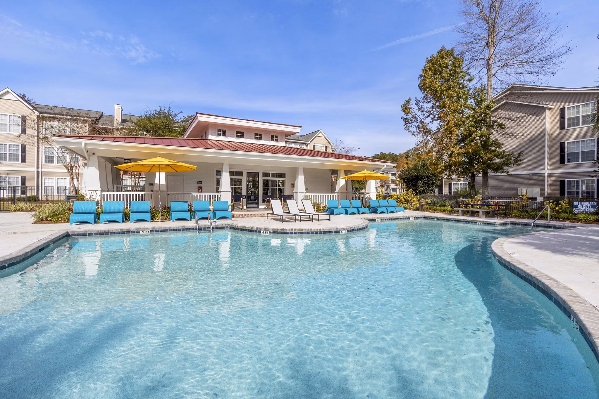 Resort-style outdoor pool at The Reserve at Wescott Apartments, offering luxury leisure amenities