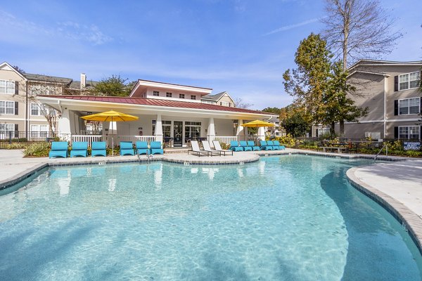 Resort-style outdoor pool at The Reserve at Wescott Apartments, offering luxury leisure amenities