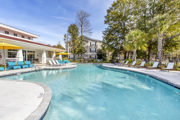 Resort-style pool with sundeck at The Reserve at Wescott Apartments