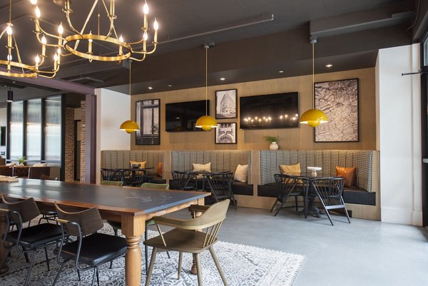Clubhouse at The Boulevard: Modern meeting space with comfortable seating in Grant Park apartments, ideal for social gatherings