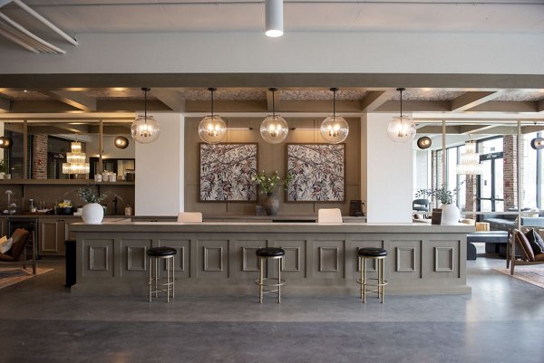 Clubhouse featuring modern decor and spacious seating at The Boulevard at Grant Park Apartments, luxury living near downtown amenities