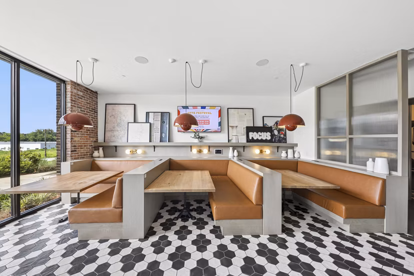 Clubhouse featuring modern design and seating areas in The Boulevard at Grant Park Apartments