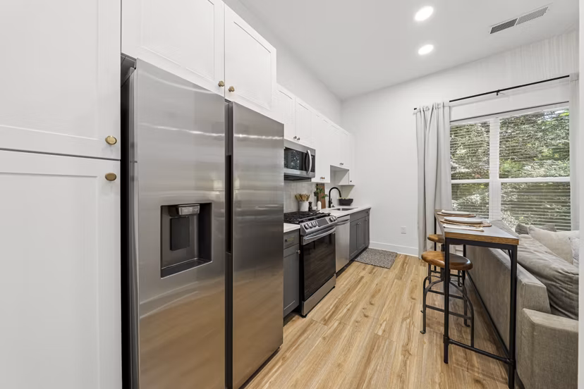 Modern kitchen with stainless steel appliances at The Boulevard at Grant Park Apartments