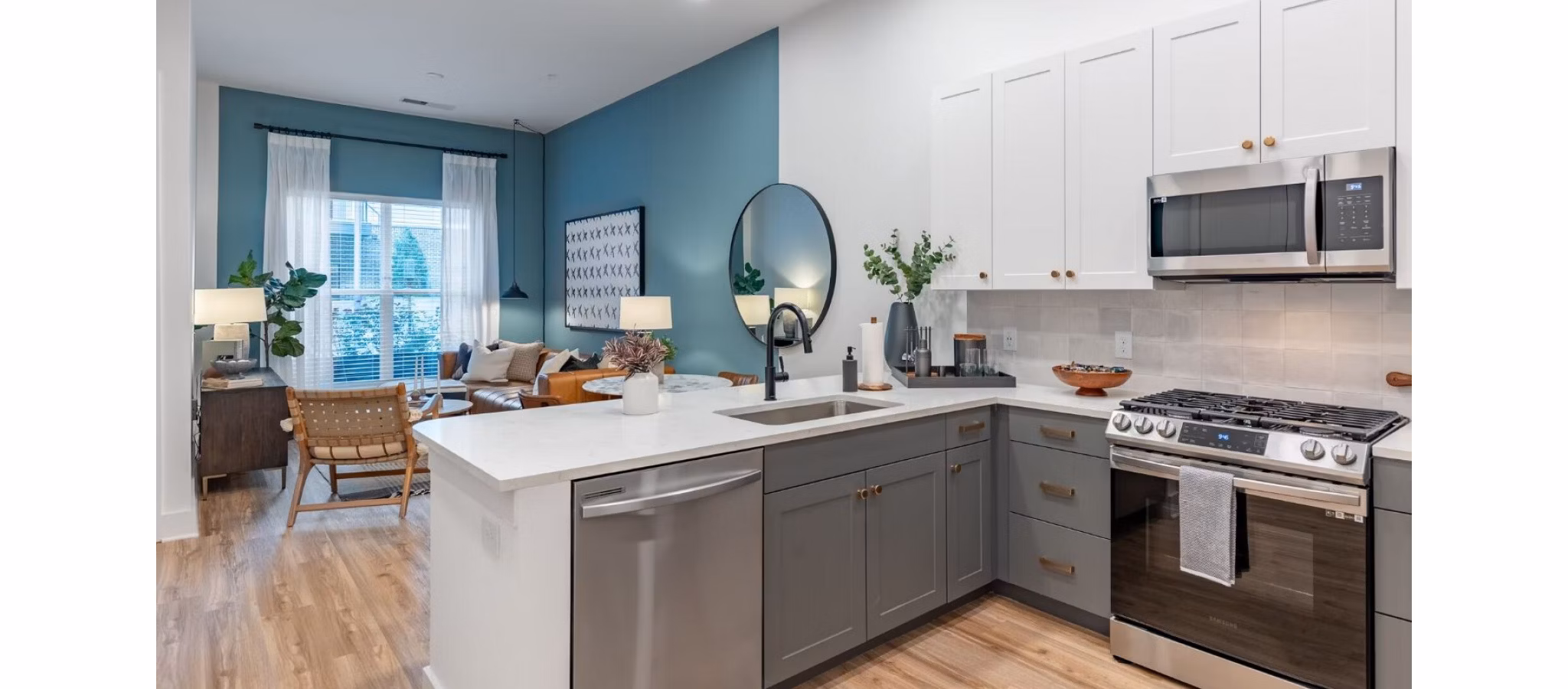Modern kitchen with stainless steel appliances at The Boulevard at Grant Park Apartments