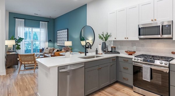 Modern kitchen with stainless steel appliances at The Boulevard at Grant Park Apartments