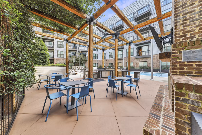 Grill area with picnic tables at The Boulevard at Grant Park luxury apartments