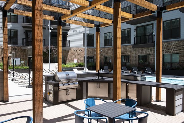 Grill area with picnic tables at The Boulevard at Grant Park luxury apartments