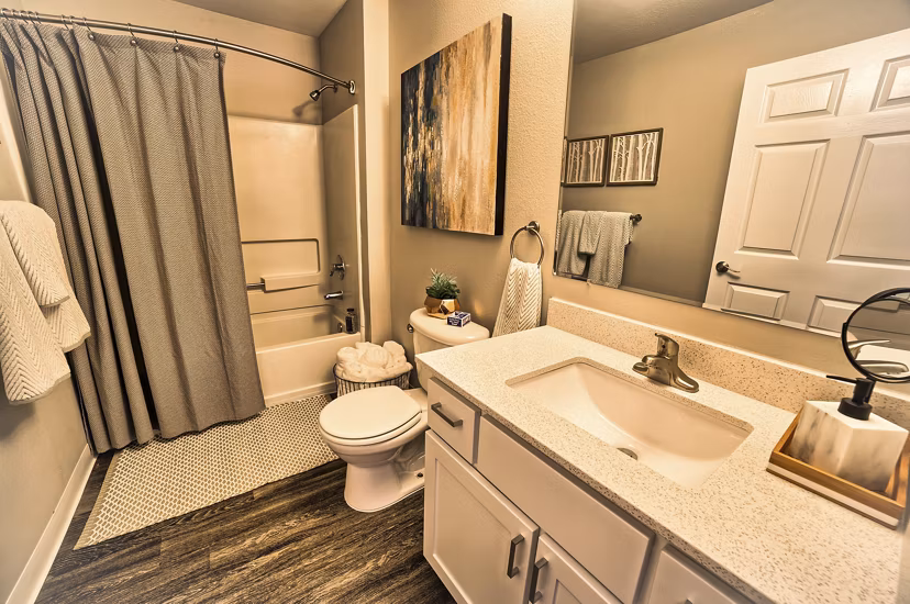 Luxurious bathroom featuring marble countertops and modern fixtures at The Arden Apartments
