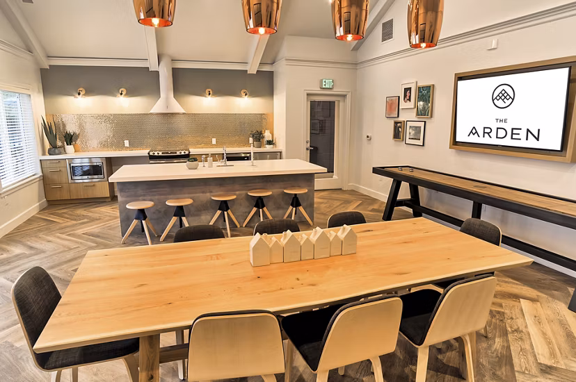 Modern clubhouse at The Arden Apartments with luxury seating and entertainment options Enjoy premium amenities in a vibrant Greystar community