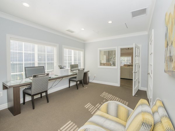 Business center with modern workstations at The Arden Apartments