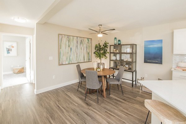 Elegant dining area with designer lighting at The Arden Apartments, featuring open concept spaces for luxurious living