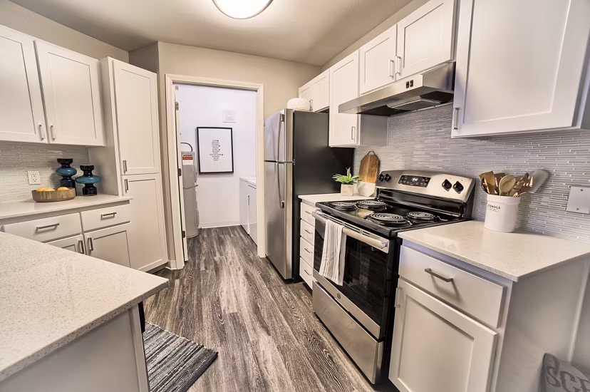 Modern kitchen with stainless steel appliances in The Arden Apartments
