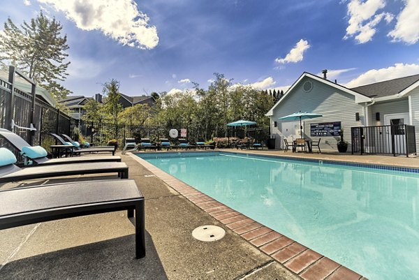 Rooftop pool with city skyline views at The Arden Apartments, offering luxury living by Greystar