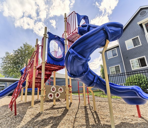 Playground featuring modern play structures at The Arden Apartments