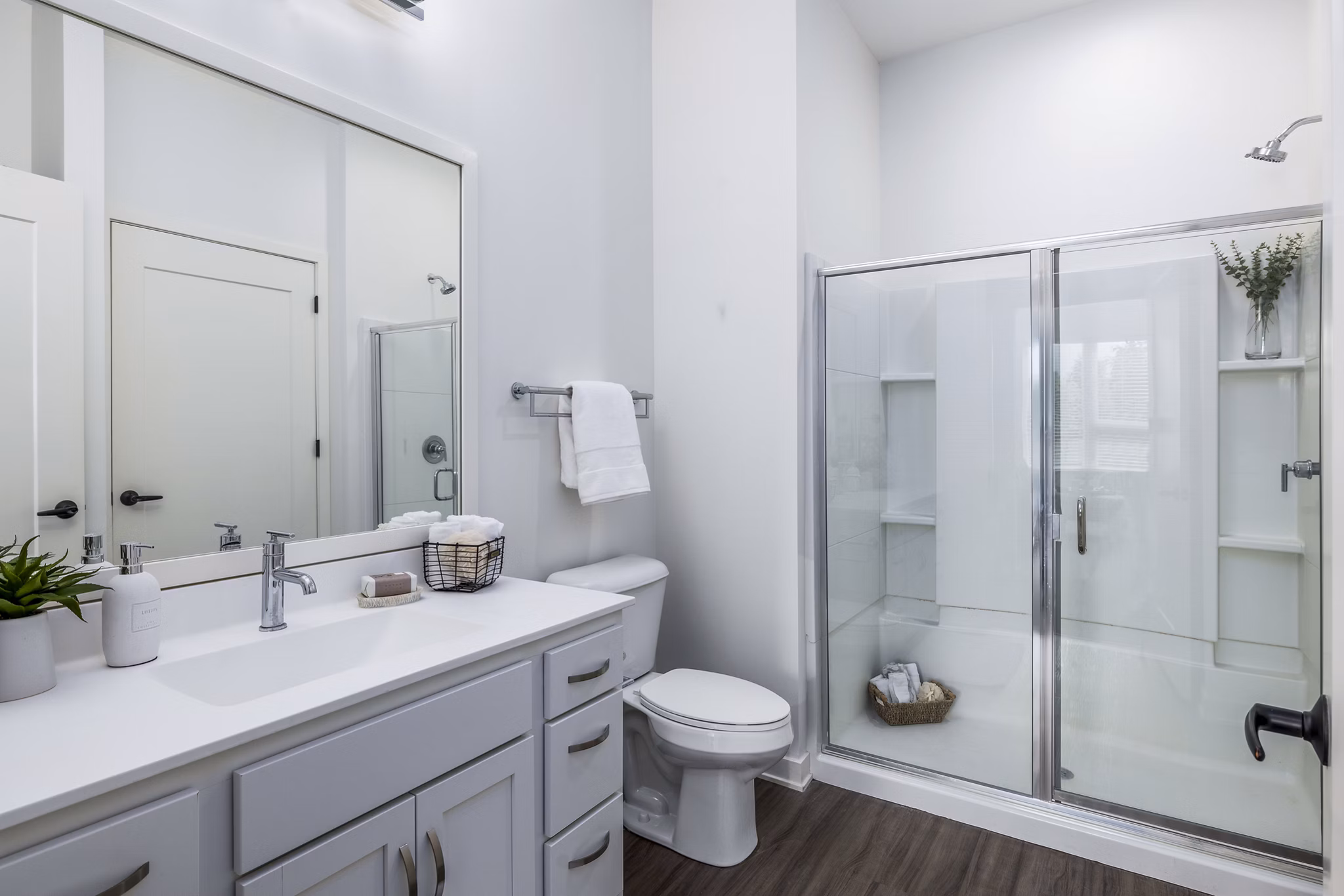Modern bathroom with sleek fixtures and accent lighting at Avidor Omaha Apartments