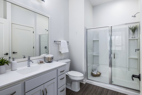 Modern bathroom with sleek fixtures and accent lighting at Avidor Omaha Apartments