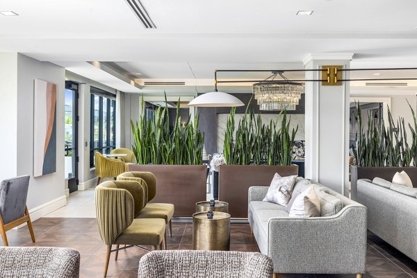 Elegant clubhouse at Avidor Omaha Apartments with modern design and plush seating