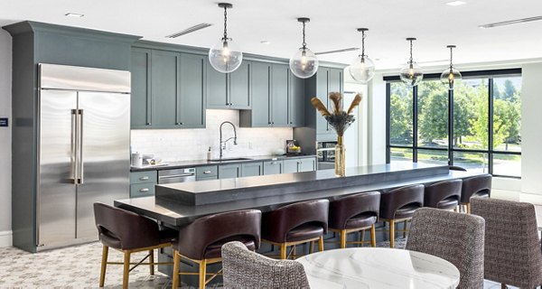 Modern kitchen with stainless steel appliances in the clubhouse at Avidor Omaha Apartments
