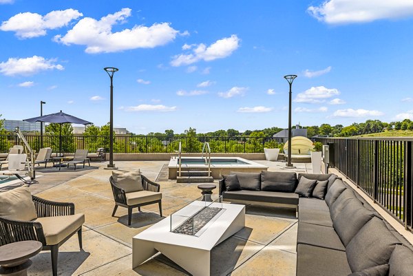 Cozy outdoor fire pit on patio at Avidor Omaha Apartments, offering luxury leisure space perfect for relaxation