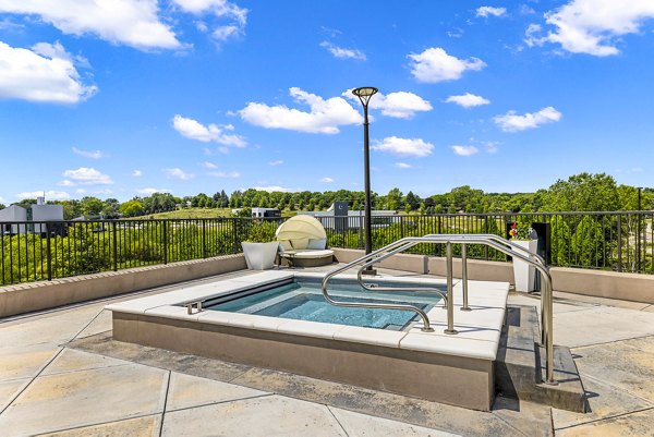 Relaxing outdoor hot tub at Avidor Omaha Apartments, perfect for unwinding in style and comfort