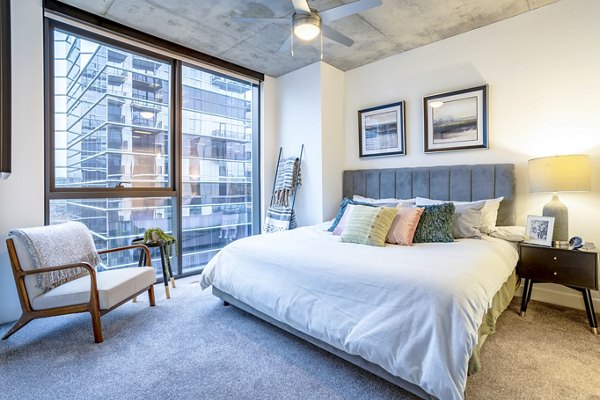 Bedroom with modern decor and stylish furniture at Avidor Evanston Apartments