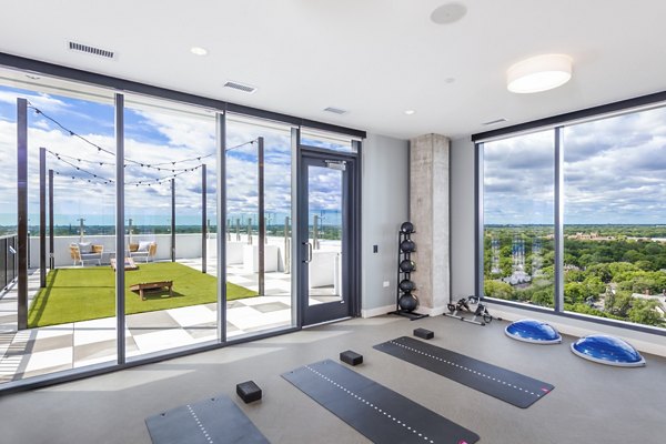 Serene yoga studio with natural light at Avidor Evanston Apartments for relaxation and fitness enthusiasts