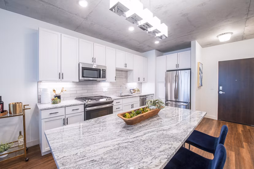 Modern kitchen with stainless steel appliances at Avidor Evanston Apartments