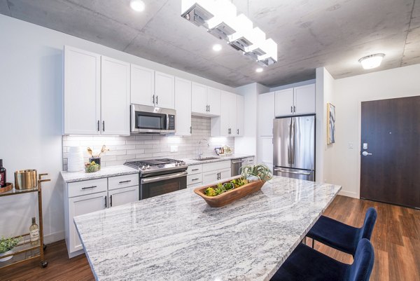 Modern kitchen with stainless steel appliances at Avidor Evanston Apartments