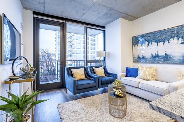 Spacious living room with modern furnishings at Avidor Evanston Apartments