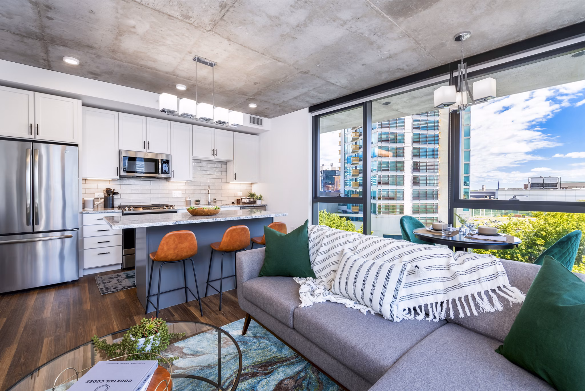Living room featuring modern decor and natural light in Avidor Evanston Apartments