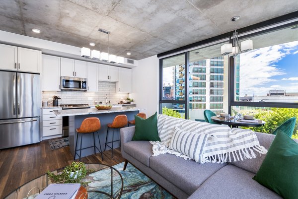 Living room featuring modern decor and natural light in Avidor Evanston Apartments