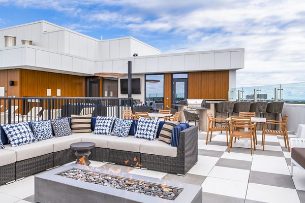 Outdoor fire pit/patio area at Avidor Evanston Apartments, perfect for relaxing and socializing in a modern setting