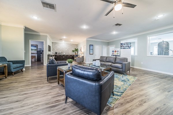 Modern clubhouse with stylish decor at Bay Cove Apartments, offering luxurious amenities and community spaces