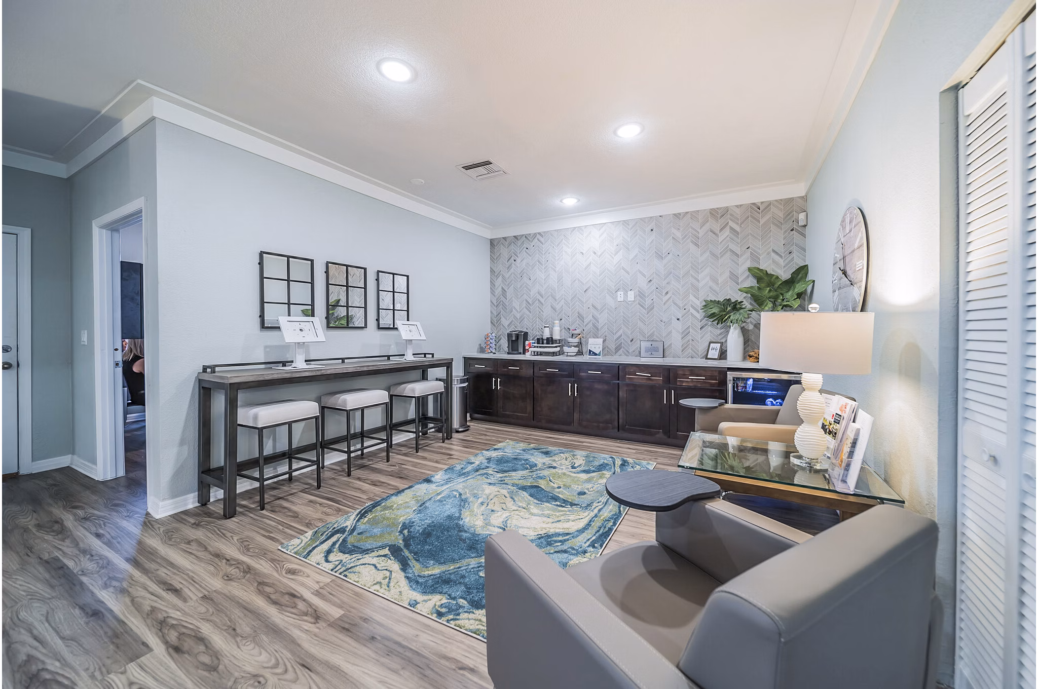 Clubhouse with modern decor and seating areas at Bay Cove Apartments