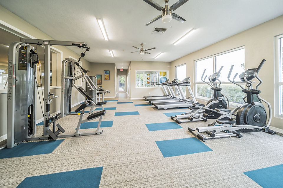 Spacious fitness center with modern equipment at Bay Cove Apartments