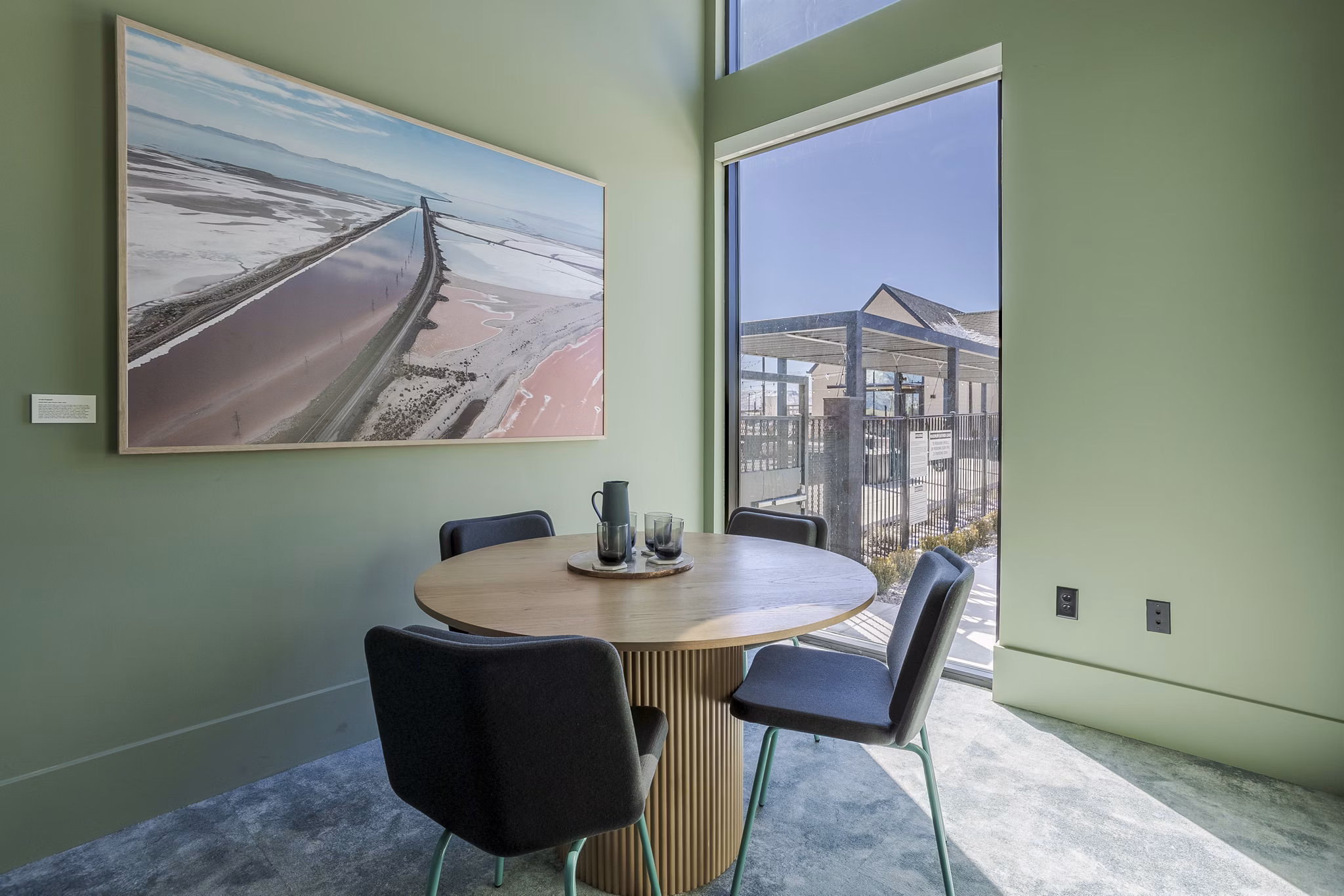 Conference room with large table and modern chairs at Novel Daybreak Apartments, ideal for meetings and events