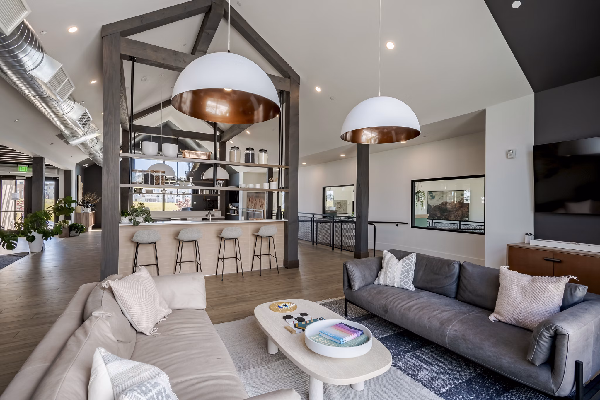Clubhouse with modern design at Novel Daybreak Apartments featuring comfortable seating and ample space for gatherings