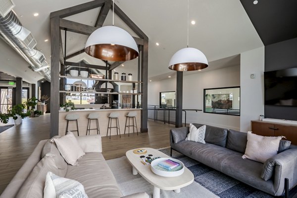 Clubhouse with modern design at Novel Daybreak Apartments featuring comfortable seating and ample space for gatherings